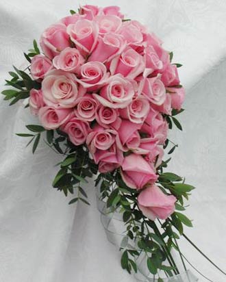 a beautiful matching bouquet of sweet pink roses